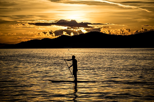Benefits of Using a Stand Up Paddle Board at Sunrise or Sunset